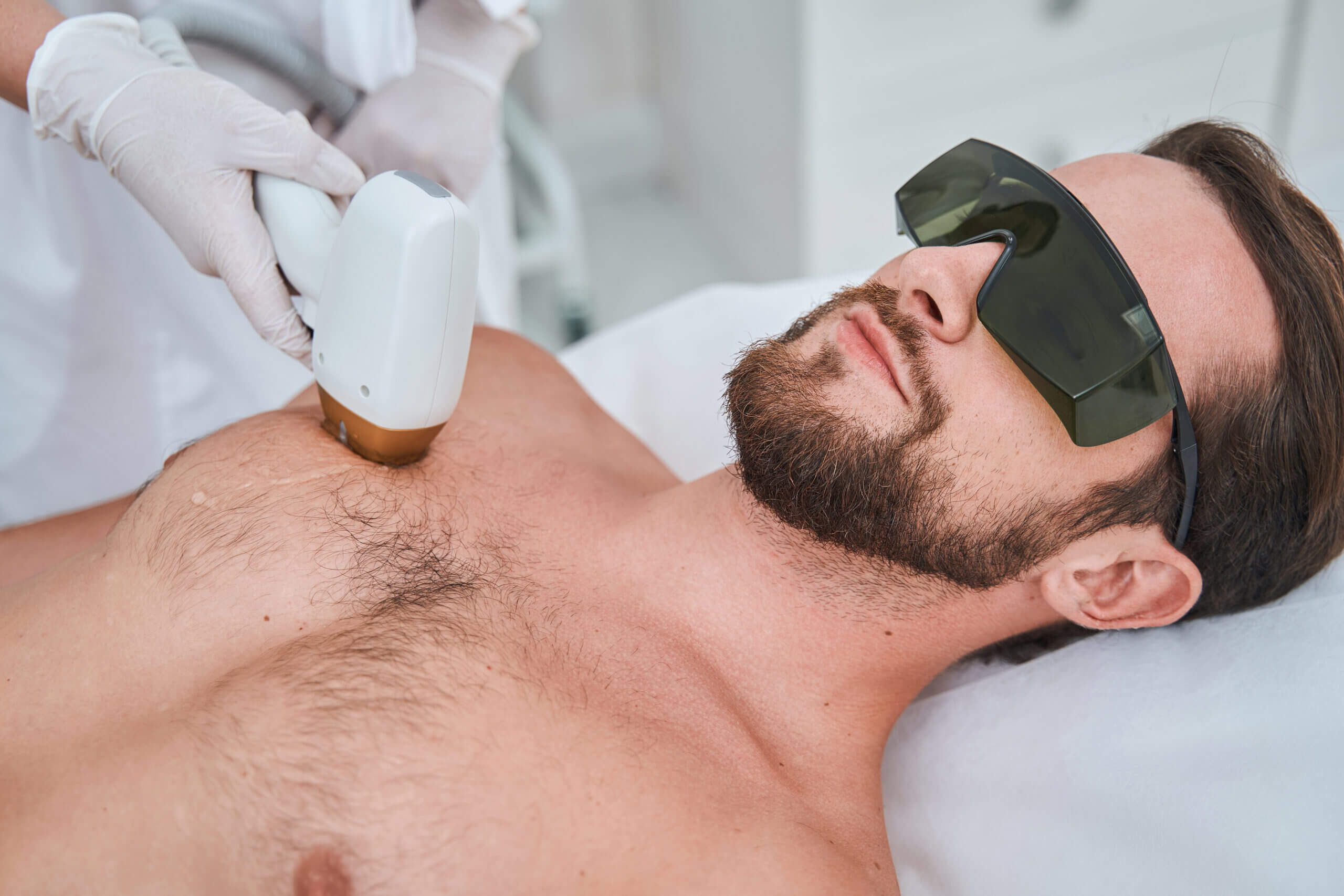 Men Receiving Laser Hair Removal Treatment By Wearing Safety Goggles | Estevez Aesthetics in Las Vegas, NV