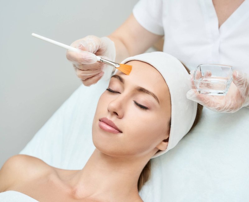 Cosmetology beauty procedure. Young woman skin care. Beautiful female person. Rejuvenation treatment. Facial chemical peel therapy. Clinical healthcare. Doctor hand. Dermatology cleanser.